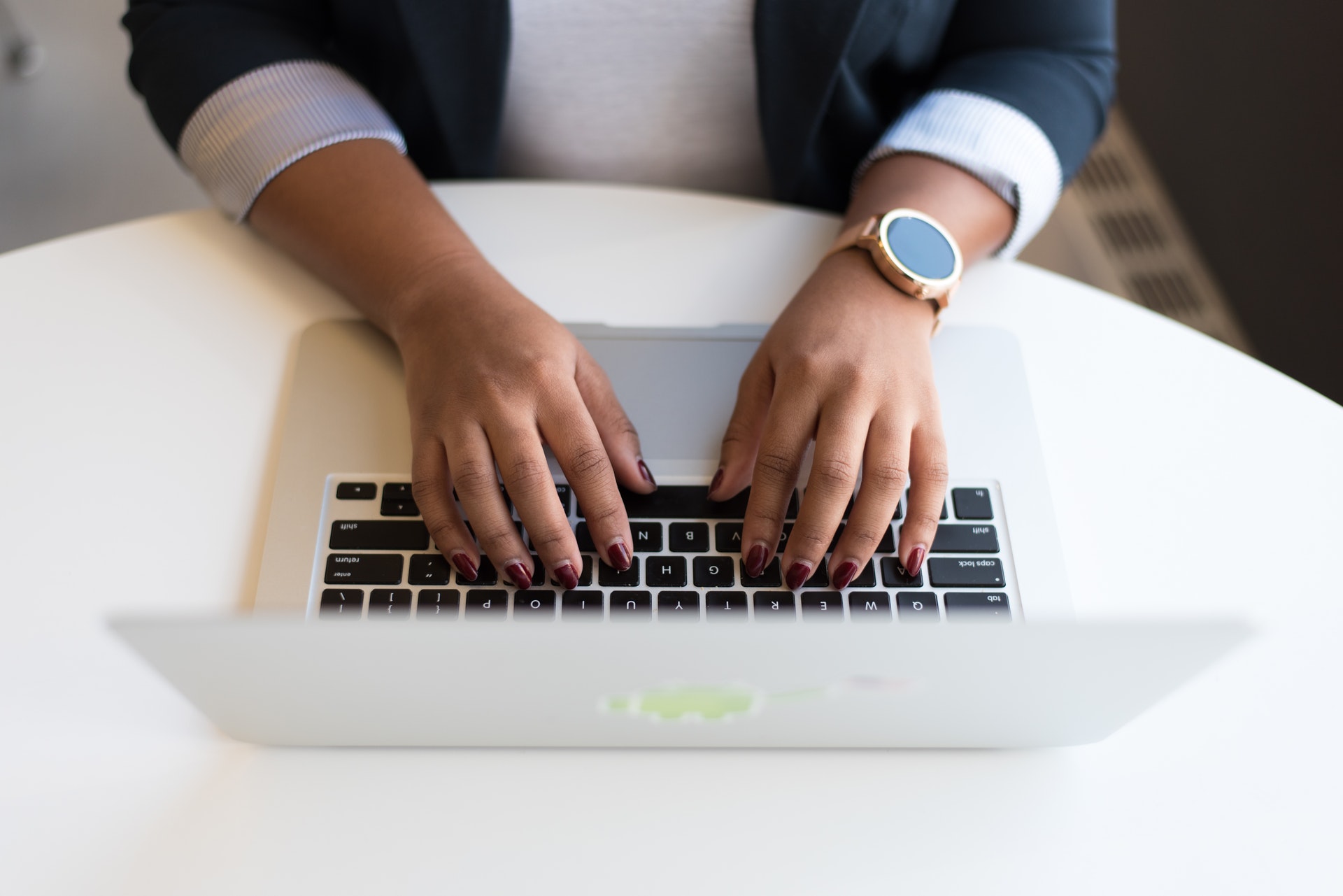 woman typing at computer